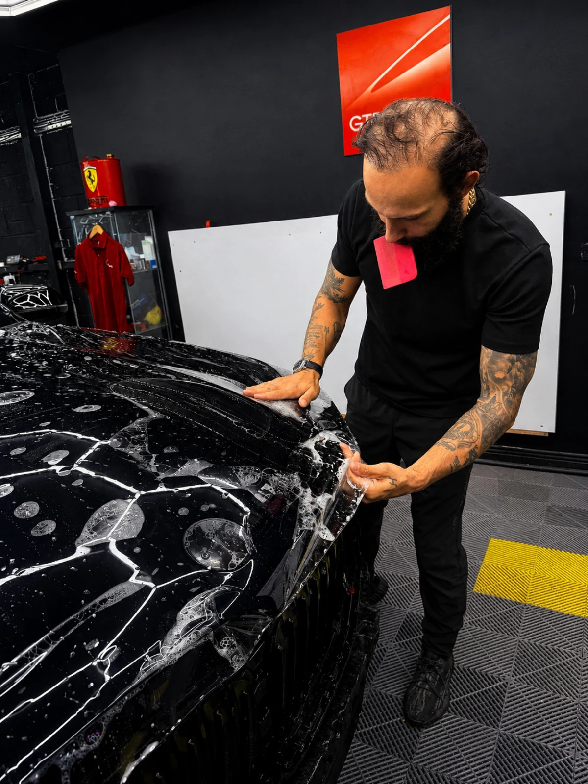 Technician installing paint protection film on BMW X5 at CarDetail Lab Dublin