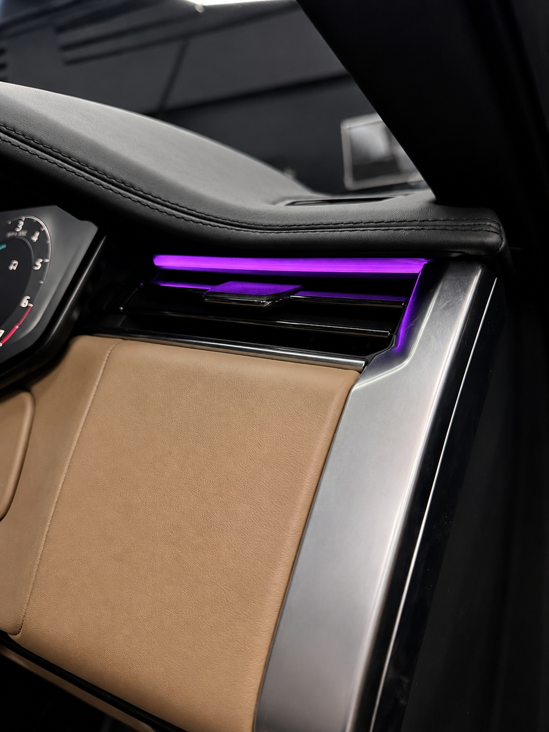 Range Rover dashboard air vent with purple LED ambient lighting close-up — CarDetail Lab Dublin