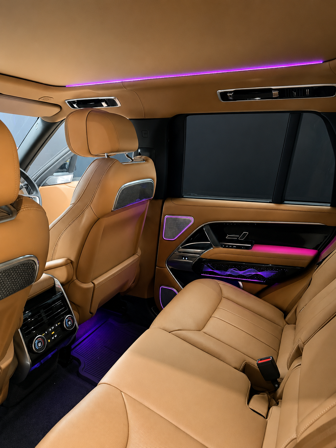 Range Rover rear cabin with purple ambient lighting and illuminated speaker covers — CarDetail Lab Dublin