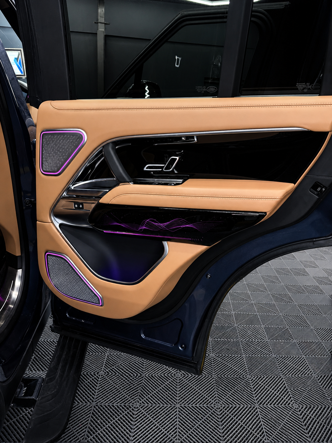 Range Rover illuminated speaker cover and gloss pattern door trim detail — CarDetail Lab Dublin